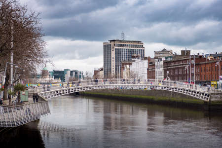 River Liffey and Ha'Penny Bridge in Dublin Ireland.