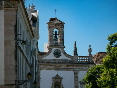 Bell tower at gates to old town of Faro, Algarve, Portugal on a sunny summer day.のeditorial素材