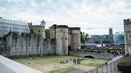 Tower of London in London, England under maintenance with scaffolding and plastic sheeting