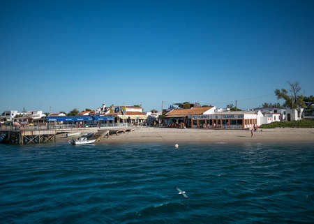 Beach on Armona Island in Algarve, Portugal on a sunny summer day with blue skyのeditorial素材