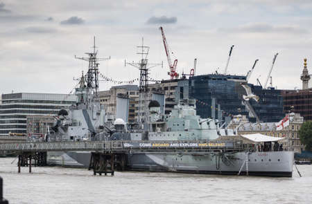 HMS Belfast, former Royal Navy light cruiser during WW2, now a museum ship, berthed on the River Thames in London, England.のeditorial素材