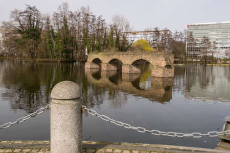 Remnants of old historic Aqueduct, now in the middle of a lake in Cologne, Germany.のeditorial素材