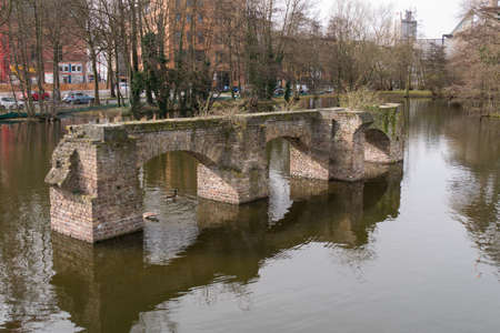 Remnants of old historic Aqueduct, now in the middle of a lake in Cologne, Germany.のeditorial素材