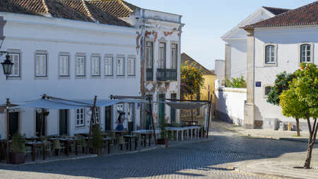 Street restaurant in old town of Faro, Algarve, Portugal.のeditorial素材