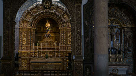 Statue of baby Jesus and St Mary with gold crowns in Faro Cathedral, Algarve, Portugal
