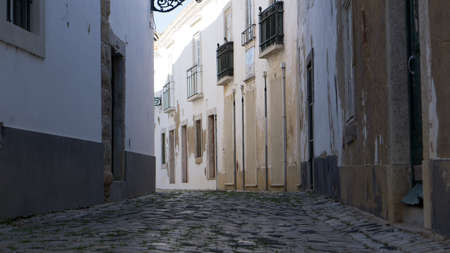 Cobbled street in old town of Faro, Algarve, Portugalの写真素材