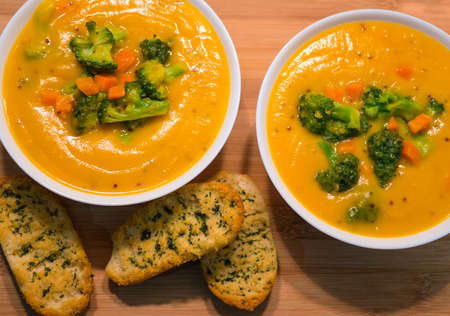 Vegetable soup with broccoli and carrots with crusty bread.