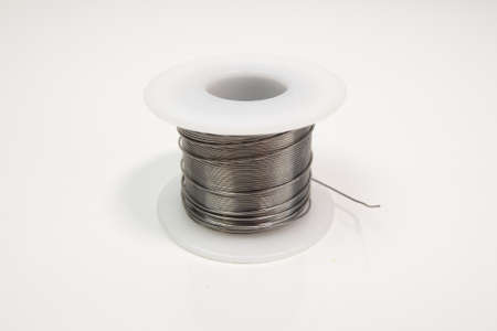 Soldering wire on white table.の写真素材