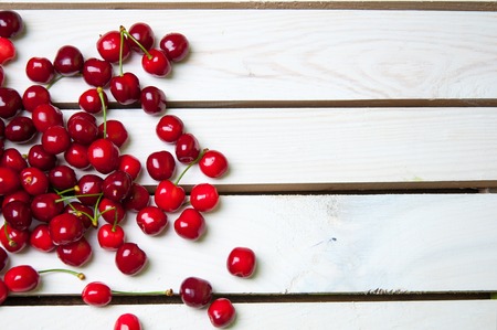 Gean - sweet cherry berries on white woodの写真素材