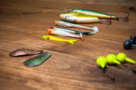 Fishing lures on old wooden bridgeの写真素材