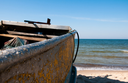 Bow of a wooden boat on the seaの写真素材