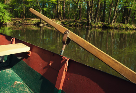 Boat and oar on the lake seen from the insideの写真素材