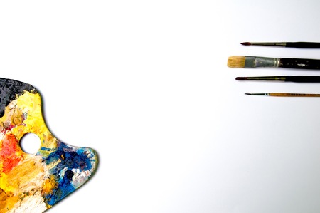 Palette with brushes on a white backgroundの写真素材