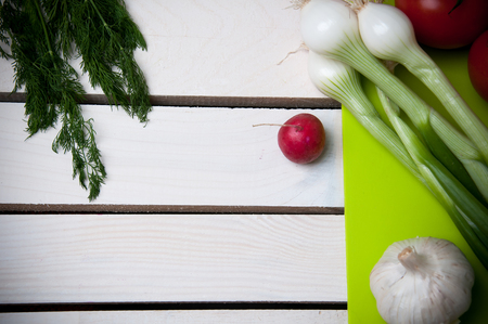 Vegetables on cutting board, wooden vintage backgroundの写真素材