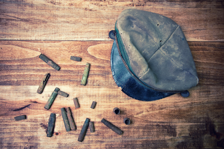 Old cartridge shells and military capの写真素材