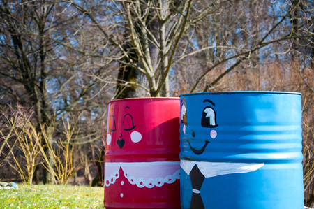 Two funny painted trash binsの写真素材