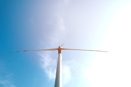 Wind turbine on blue sky