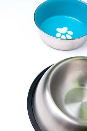 Empty pets bowls isolated on whiteの写真素材