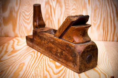 Wood plane isolated on wooden backgroundの写真素材
