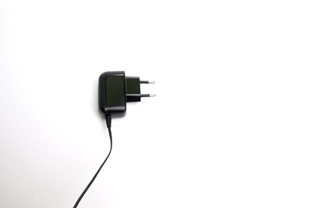 Black phone charger isolated on whiteの写真素材