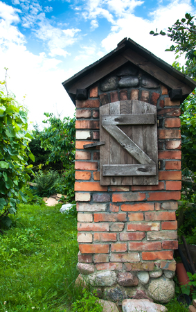 Traditional rural smokehouse on countryの写真素材