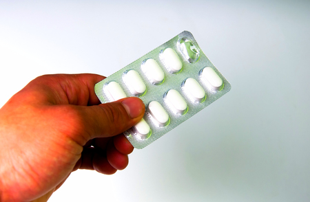 Hand holding medical drugsの写真素材
