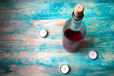 Rose wine closeup on blue wooden backgroundの写真素材
