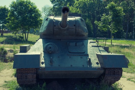 Old postwar tank near forestの写真素材
