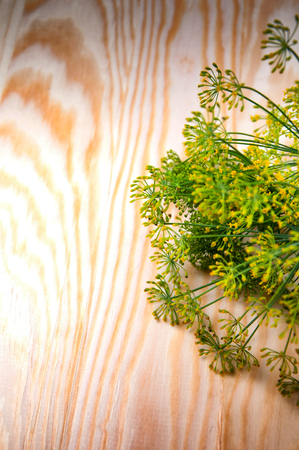 Wild fennel flower on wooden tableの写真素材
