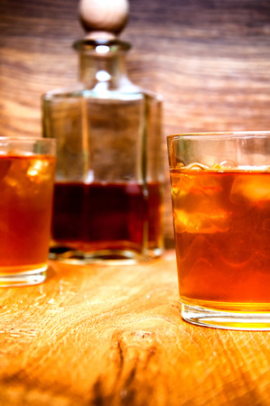Glass of scotch whiskey on a wooden tableの写真素材