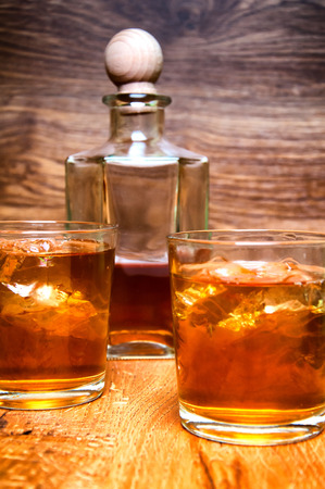 Glass of scotch whiskey on a wooden tableの写真素材
