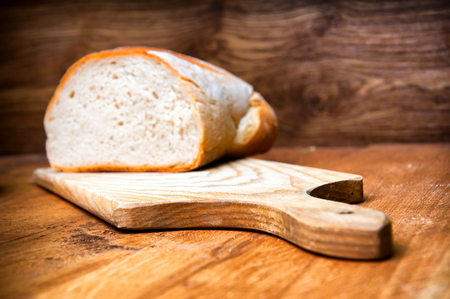 Fresh bread on wooden backgroundの写真素材