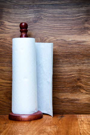 Kitchen paper towel on wooden holderの写真素材