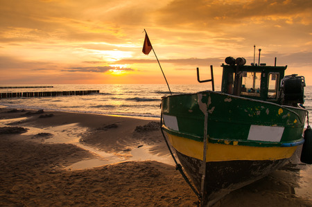 Majestic sunset over fisherman's boatの写真素材