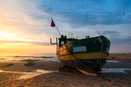 Majestic sunset over fisherman's boatの写真素材