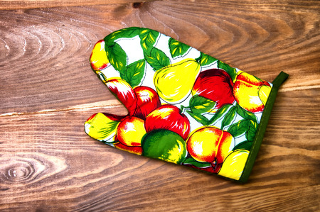 Colorful kitchen glove on tableの写真素材