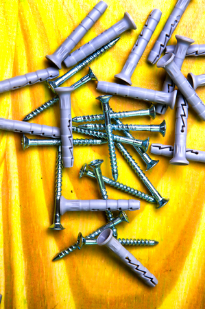 Dowels on green wooden background