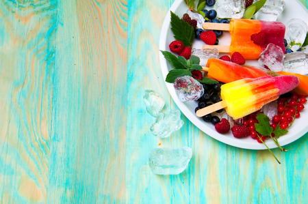 Composition of delicious ice cream, fruits and ice cubesの写真素材