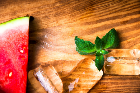 Pieces of watermelon on wooden backgroundの写真素材