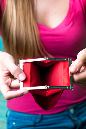 Girl holding empty wallet