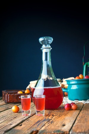 Healthy plum tincture in old kitchenの写真素材