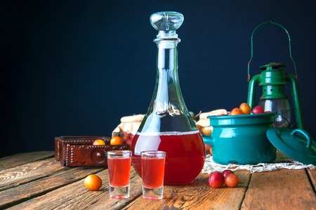 Healthy plum tincture in old kitchenの写真素材