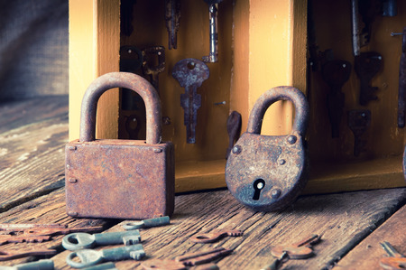 Boxes with old keys and padlocksの写真素材