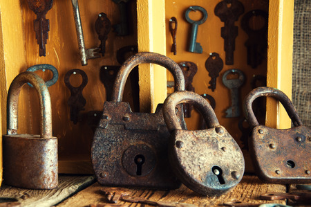 Boxes with old keys and padlocksの写真素材