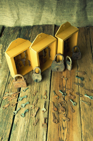 Boxes with old keys and padlocksの写真素材