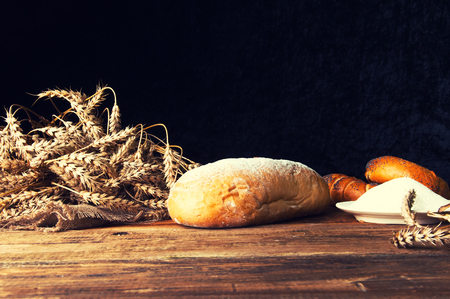 Homemade loaf of bread and ingredientsの写真素材