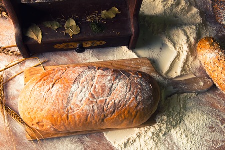 Homemade loaf of bread and ingredientsの写真素材