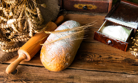 Homemade loaf of bread and ingredientsの写真素材
