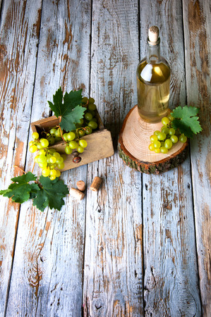 Bottle of white wine and grapeの写真素材