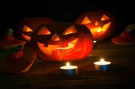 Scary halloween pumpkins on dark backgroundの写真素材